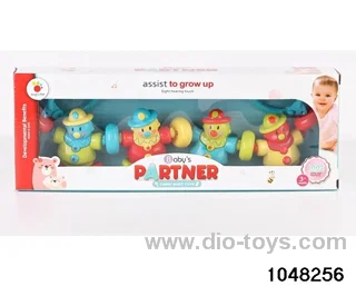 The baby pulls the clown with four hands in window box